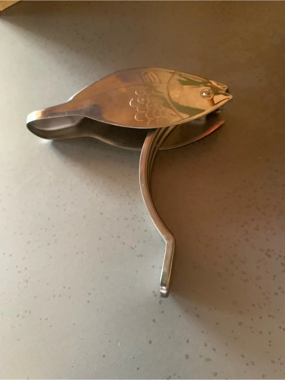 Stainless Fish shaped lemon squeezer and a Good Cook 9.5 inch meat tenderizer.